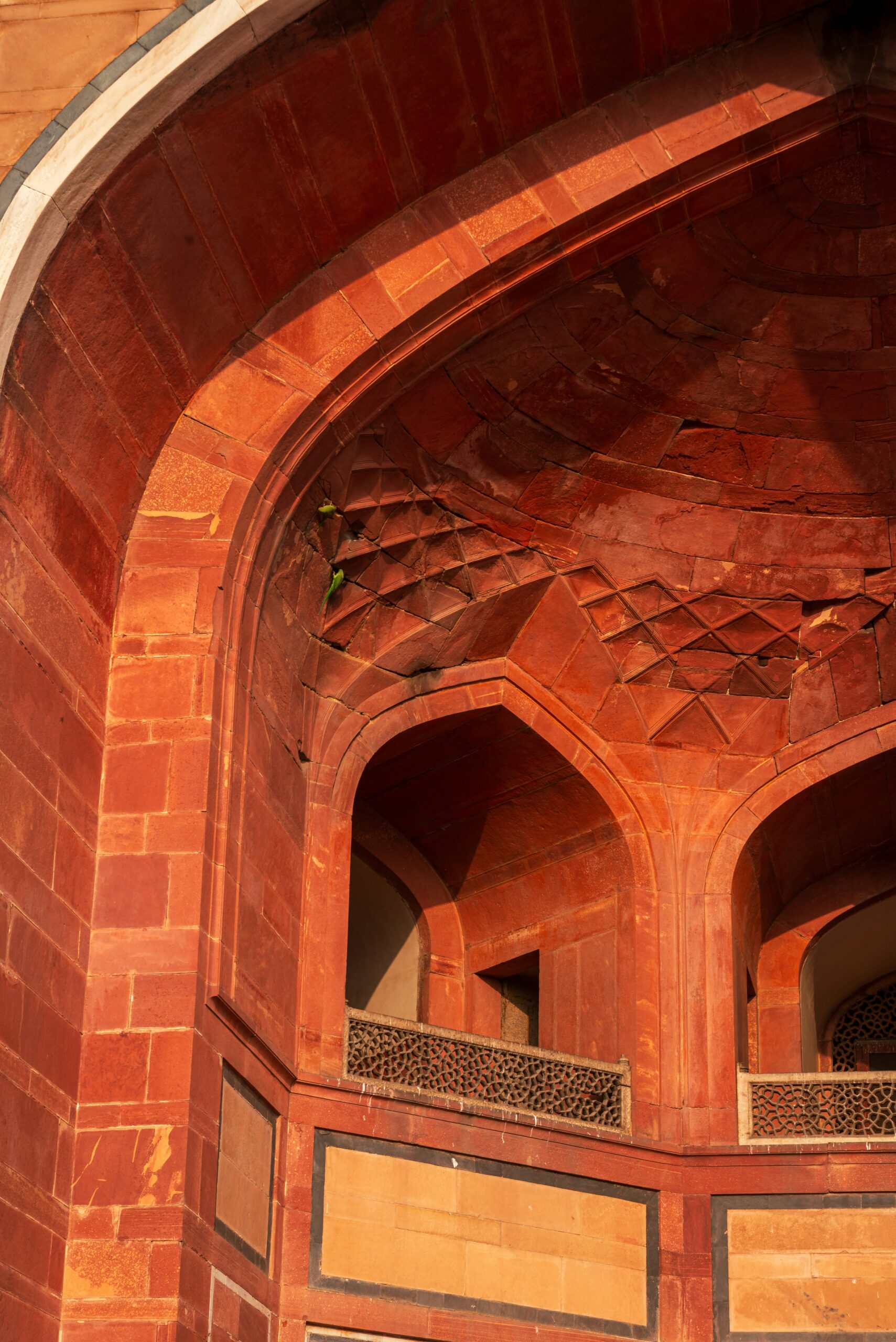 Arched doorway in red sandstone and marble